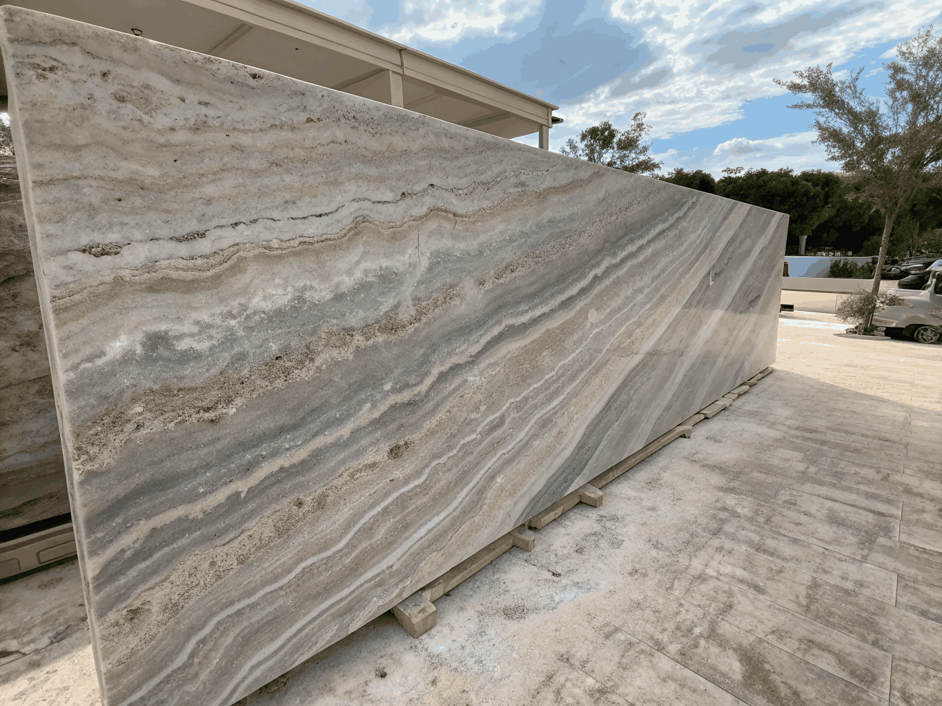 Neutral architectural grey granite slab with uniform grain structure